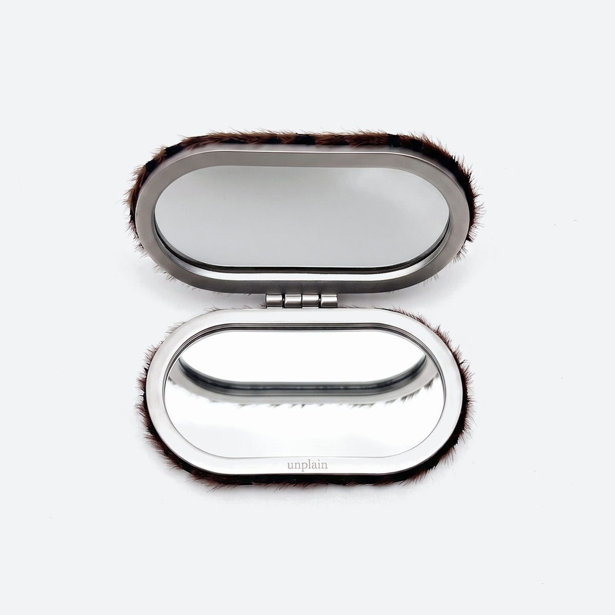 Compact mirror open
