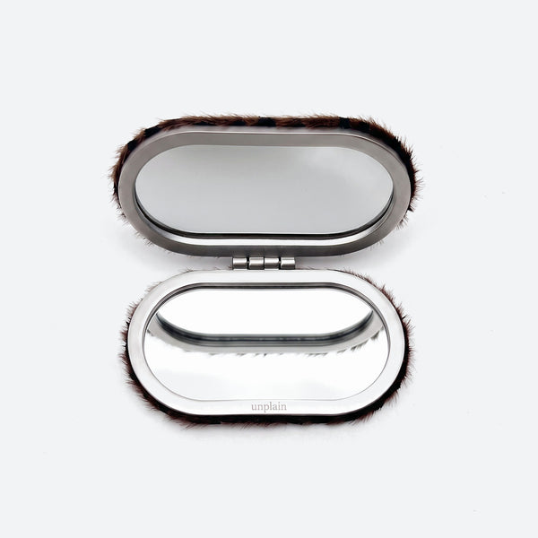 Compact mirror open