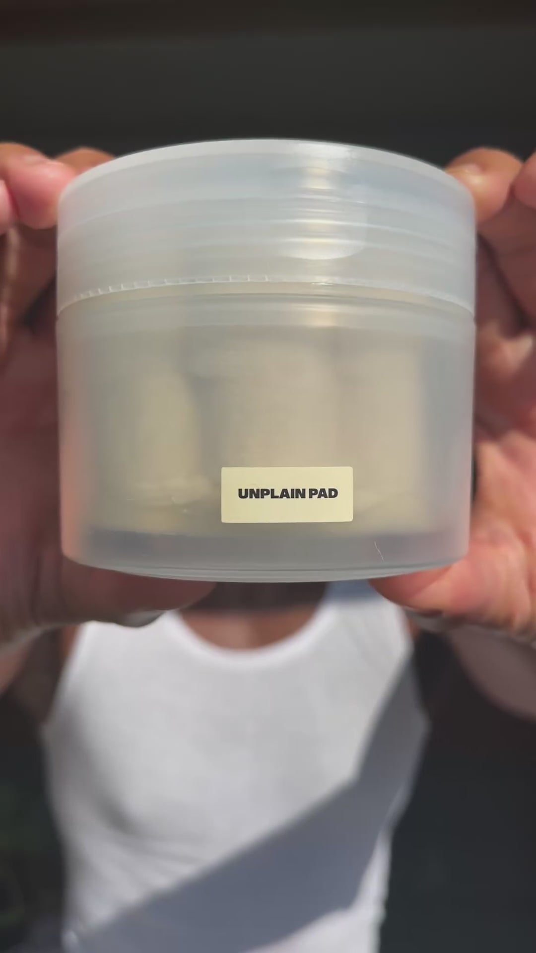 Male influencer using Unplain Pad to gently exfoliate skin